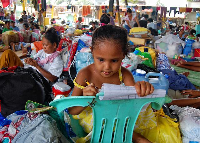 Young girl in an evacuation center, 2009. Philippines. Photo: Jerome Ascano / World Bank